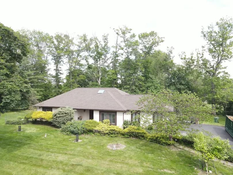 New asphalt shingles on a residential home during a full roof replacement