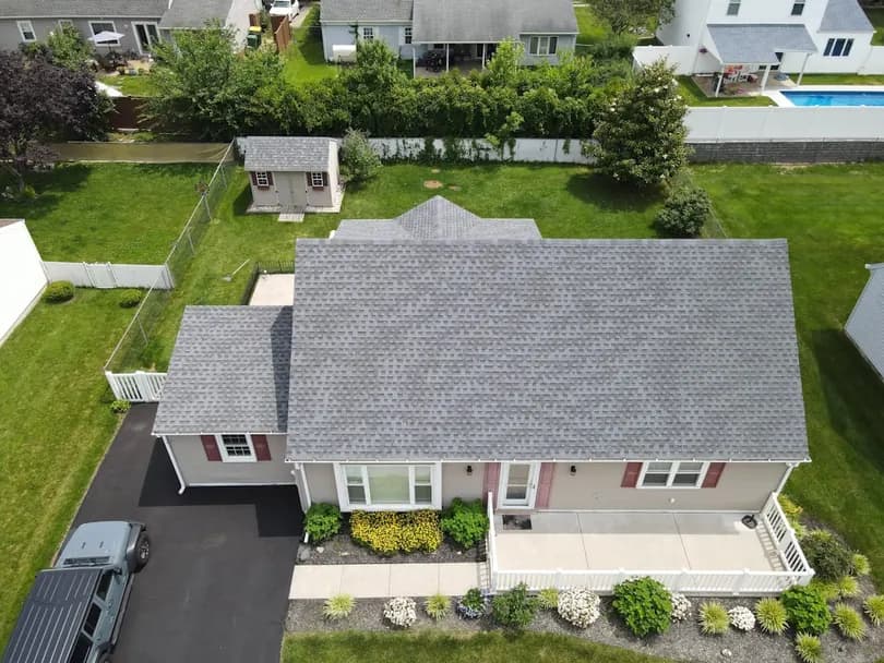 A freshly replaced asphalt shingle roof on a residential home, the kind of finished job worth filming.