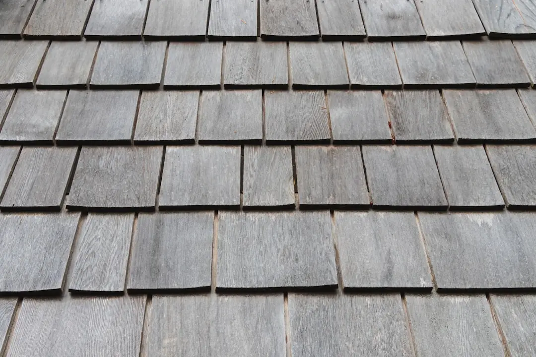 Close-up of weathered asphalt shingles on a completed roof, the kind of detail shot worth a clear description.